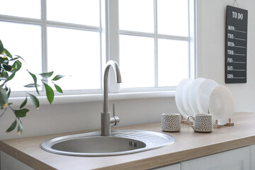 Sink in interior of modern kitchen