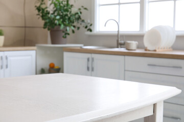 Dining table in interior of modern kitchen