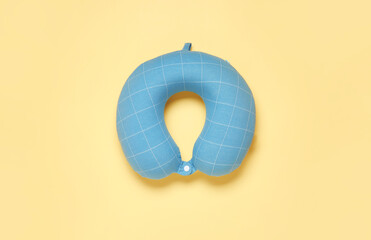 Travel pillow on color background