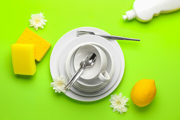 Composition with clean dishes on color background