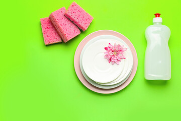 Composition with clean dishes on color background