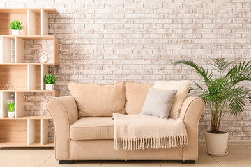 Interior of room with comfortable sofa