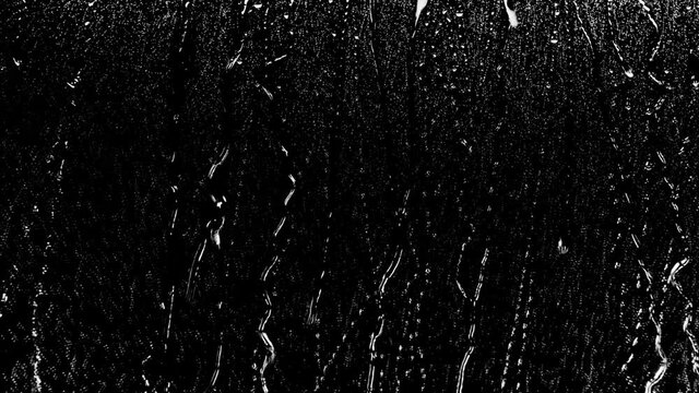 4k Rain Drops Falling down on black background, 4K High quality footage of Rain on Window Sky Drops, Close up Slow Rain, Rainy at night, Heavy Rainfall. Raining at night.