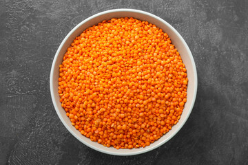 Bowl with red lentils on table