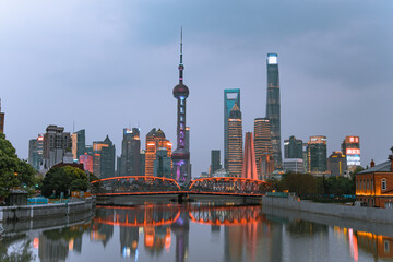Night view of Waibaidu Bridge and Lujiazui, the skyline and landmark in Shanghai, China, with...