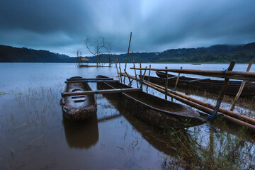 Fototapeta premium Cloudy boats on the lake