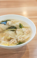 Fototapeta premium Wonton soup, Chinese traditional food with boiled meat filled wonton and seaweed soup.
