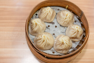 Shanghai Meat juicy dumplings, traditional snack in Shanghai, steamed dumplings with meat and soup inside.
