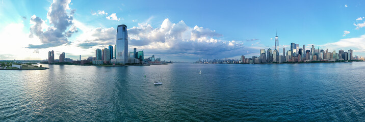 Aerial panorama of New York City skyline at sunny day with both midtown and downtown Manhattan