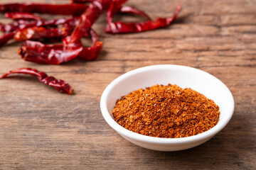 Crushed dried chili peppers in white bowl.Hot and spicy Thai Condiments for thai food.