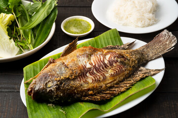 salt-crusted grilled Tilapia fish (Pla Pao Kluer)