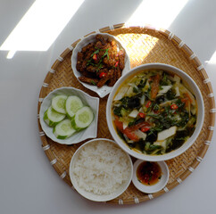 Vietnamese meal for lunch, vegetarian homemade food with seitan, vegetable soup, rice dish
