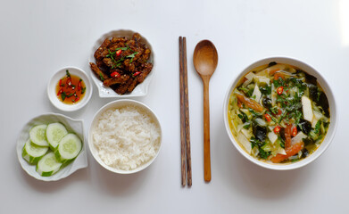 Vietnamese meal for lunch, vegetarian homemade food with seitan, vegetable soup, rice dish