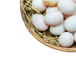 Fresh eggs in a rice straw basket isolated on white background
