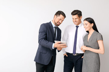 Group of business people on light background