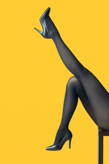 Beautiful young woman in tights on color background