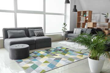 Stylish interior of living room with comfortable sofas