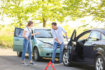 Stressed drivers near broken cars after accident