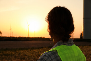 Male engineer on windmill farm for electric power production