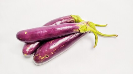 Close up fresh purple eggplant or terong isolated on white background