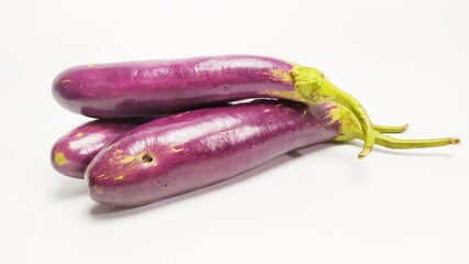 Close up fresh purple eggplant or terong isolated on white background