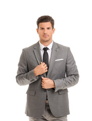 Young businessman in stylish suit on white background