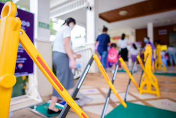 Blurred images of students and parents with a control panel to keep the distance to prevent viruses. Body thermometer Covid-19, line up to prepare for school