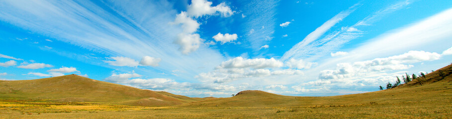 View of the hills. Mountain-steppe landscape with clouds. South Siberia. The Republic of Khakassia.