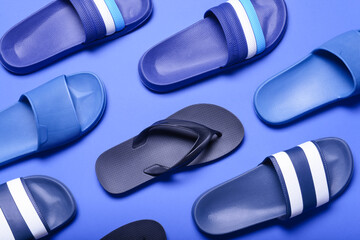 Stylish flip-flops on color background