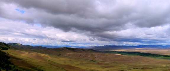View of the hills. Mountain-steppe landscape with clouds. South Siberia. The Republic of Khakassia.