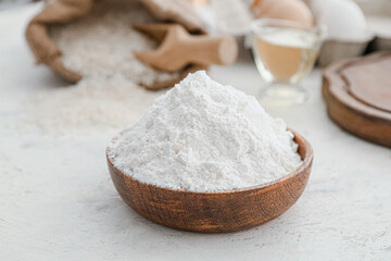 Fototapeta na wymiar Plate with rice flour on white table
