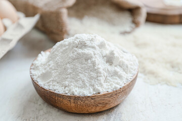 Fototapeta na wymiar Plate with rice flour on white table