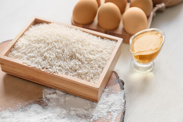 Box with rice on table