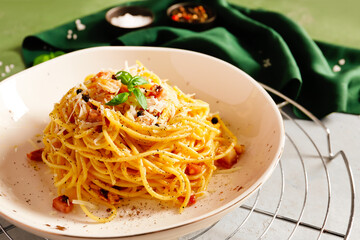 Plate with tasty pasta carbonara on table