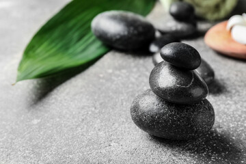 Spa stones on grey background