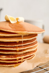 Fototapeta na wymiar Tasty pancakes with butter on table, closeup