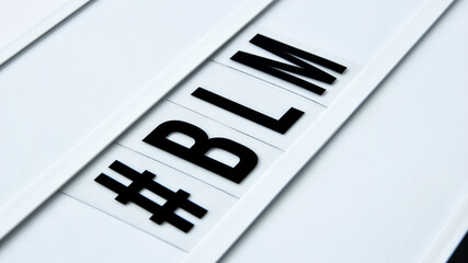 hashtag BLM BLACK LIVES MATTER text on a white background. Protest against the end of racism,...