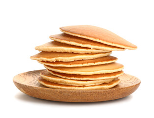 Plate with tasty pancakes on white background