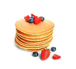 Sweet pancakes with berries on white background