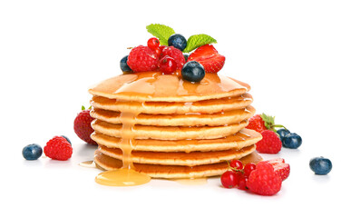 Sweet pancakes with berries on white background