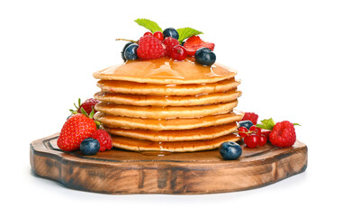 Sweet pancakes with berries on white background