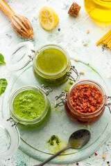 Homemade Pesto in Jars. Basil and Tomato Helthy Italian Pesto