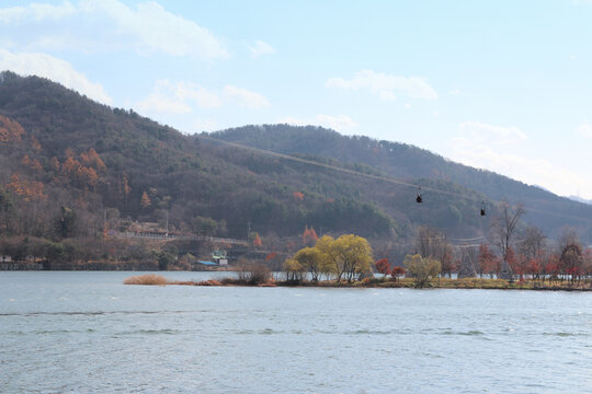Autumn scenery of Nami Island in sunny day with skyline zip-wire, South Korea