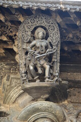 Fototapeta na wymiar Sculptures and friezes on the walls of The Chennakeshava Temple or Vijayanarayana Temple of Belur, is a 12th-century Hindu temple in the Hassan district of Karnataka state, India. 