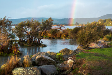rainbow over scenic lake