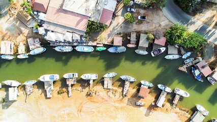  Aerial bird's eye view Liopetri river (potamos Liopetriou), Famagusta, Cyprus. Tourist attraction fishing village, fjord with colourful boats moored on banks at Kokkinochoria, Ammochostos, from above