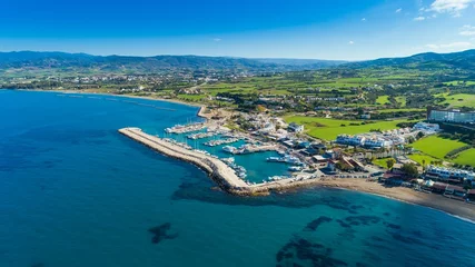 Gordijnen Aerial bird's eye view of Latchi port,Akamas peninsula,Polis Chrysochous,Paphos,Cyprus. The Latsi harbour with boats and yachts, fish restaurant, promenade, beach tourist area and mountains from above © f8grapher