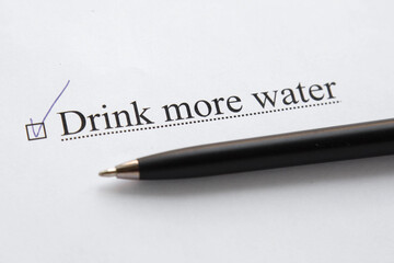 a piece of paper with the inscription drink more water from to do list with a tick