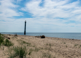 Fototapeta na wymiar landscape with an abandoned sloping lighthouse 