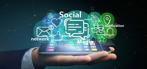 Businessman holding a cloud of social media network icon
